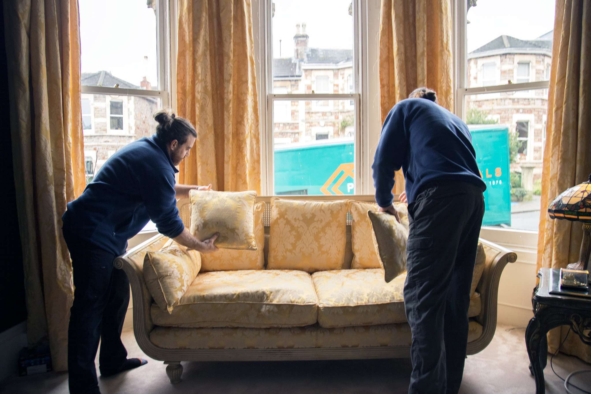 Our team moving a sofa in Clifton, Bristol