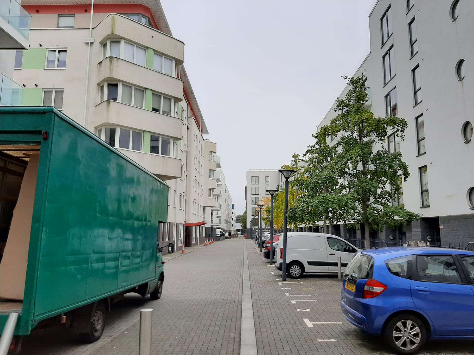 New-build housing development in Filton with a removal van on a wide residential street