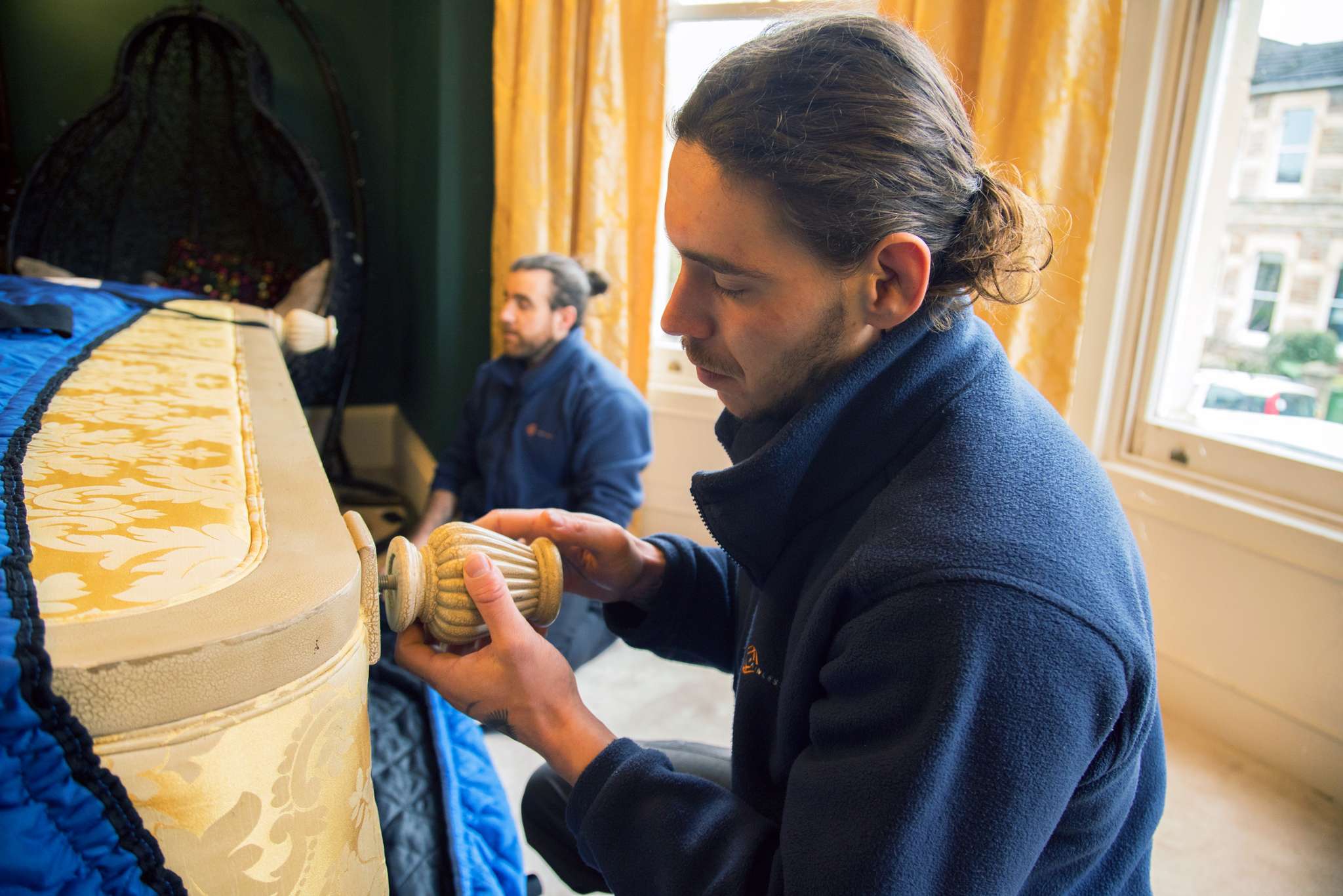 Painless Removals team handling furniture disassembly during a move