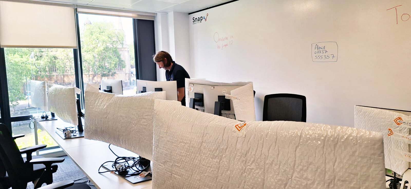 Office monitors individually wrapped and cable-managed by Painless Removals during a Bristol office move